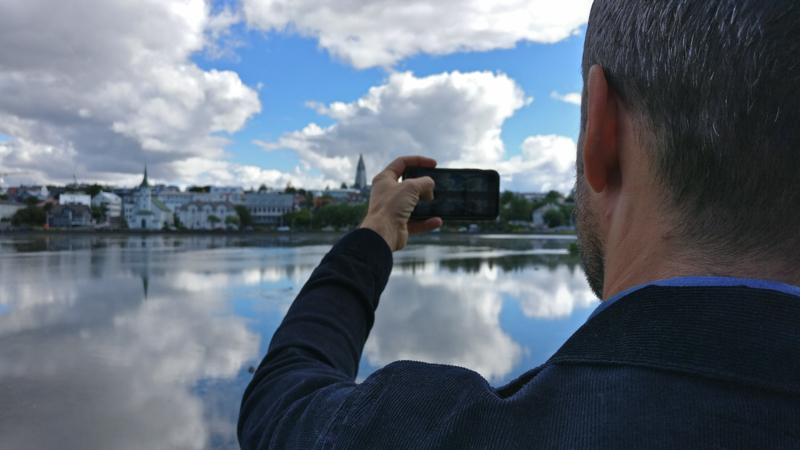 Dan Rubin taking a picture of Tjörnin, Reykjavík's city lake
